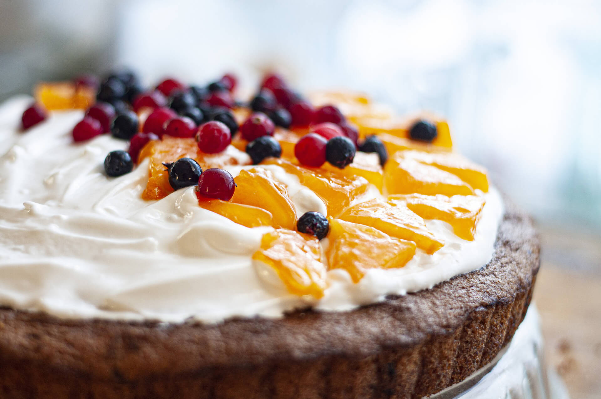 Eggless fresh-cream cake topped with fruit