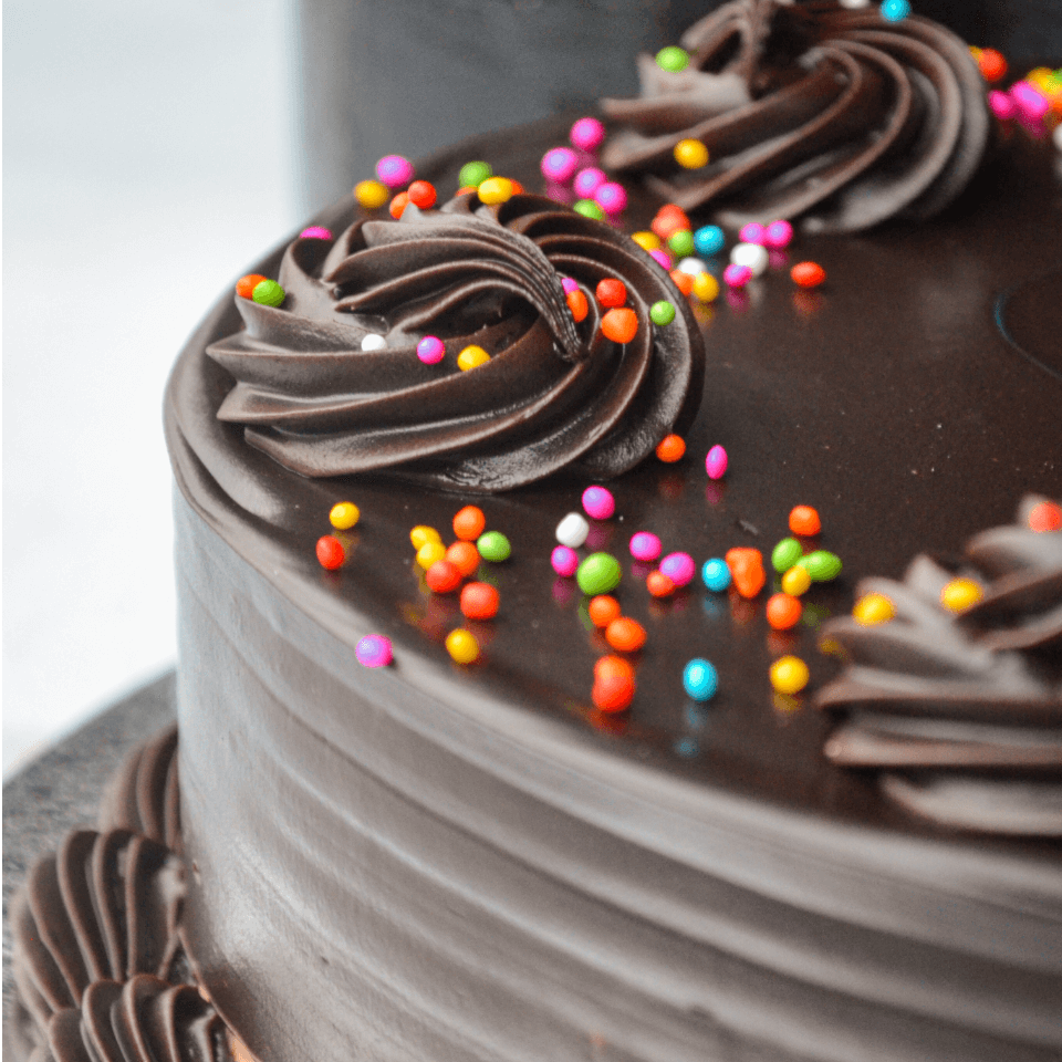 Custom chocolate celebration cake with sprinkles